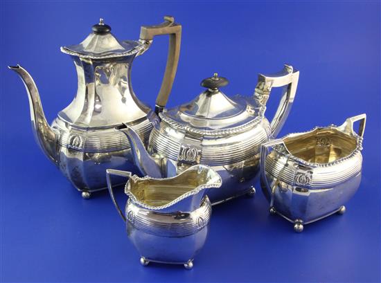 A late Victorian silver four piece tea set by Edward Barnard & Sons Ltd, gross 55 oz.